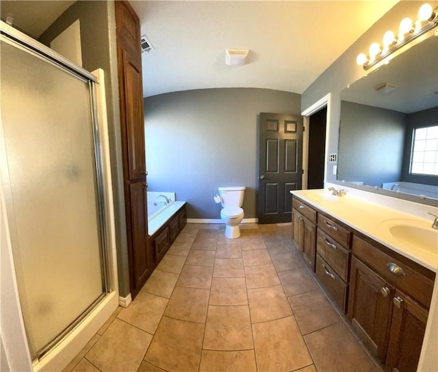 full bathroom with vanity, lofted ceiling, tile patterned flooring, toilet, and shower with separate bathtub