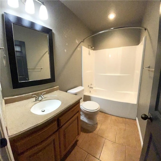 full bathroom featuring bathtub / shower combination, tile patterned floors, vanity, and toilet