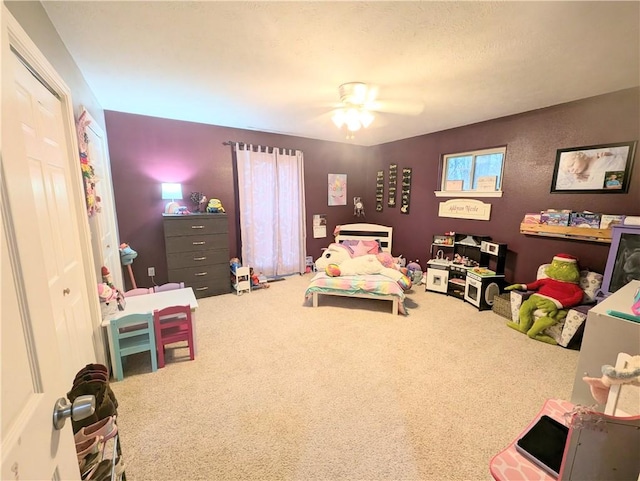 bedroom featuring carpet flooring, ceiling fan, and a closet