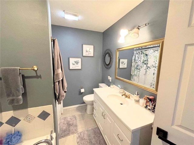 bathroom featuring tile patterned floors, vanity, and toilet