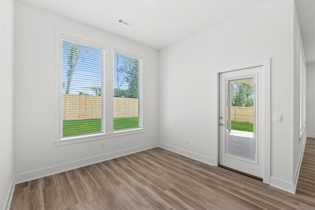 spare room with hardwood / wood-style flooring