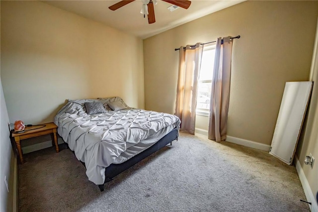 bedroom with light colored carpet and ceiling fan