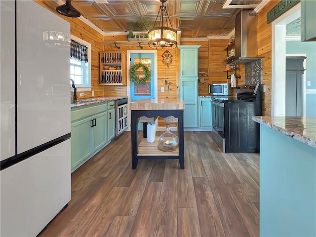 kitchen with wine cooler, dark hardwood / wood-style flooring, stainless steel appliances, and wooden walls