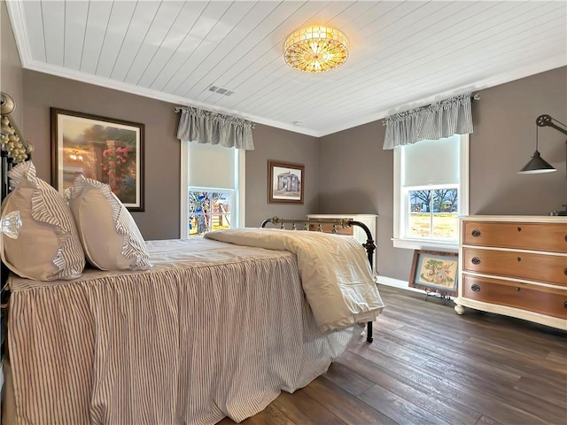 bedroom with wood ceiling, crown molding, and dark wood-type flooring