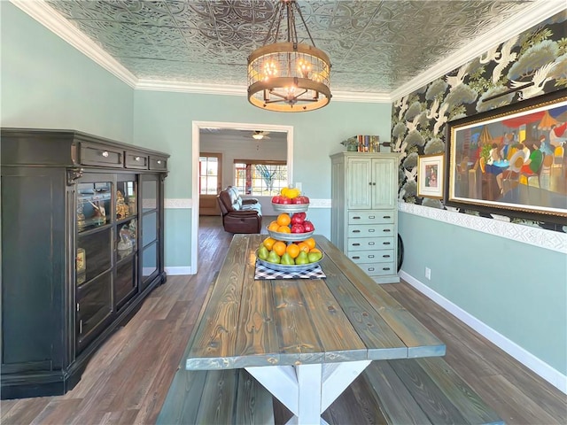 unfurnished dining area with dark hardwood / wood-style flooring, crown molding, and a notable chandelier