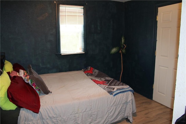 bedroom featuring hardwood / wood-style floors