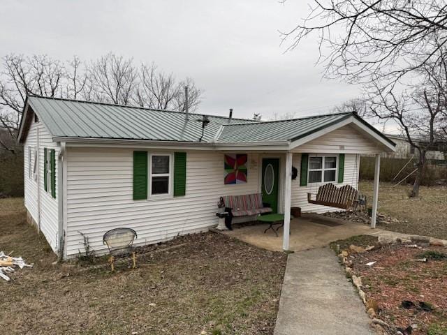 view of front of house with a patio area