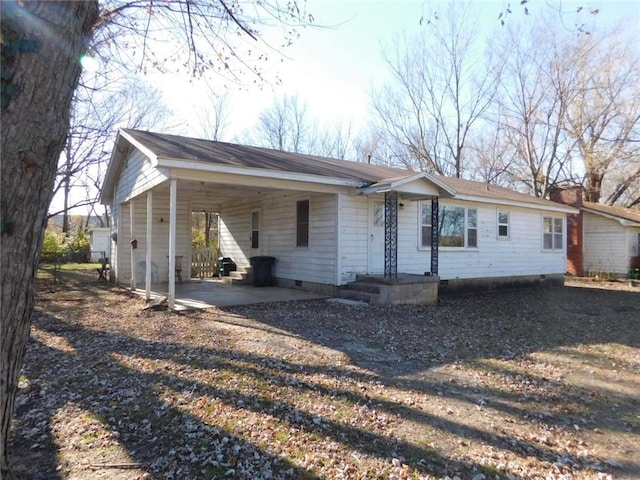 single story home featuring a carport