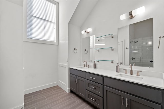 bathroom featuring vanity and a shower with shower door