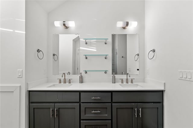 bathroom featuring vanity and vaulted ceiling