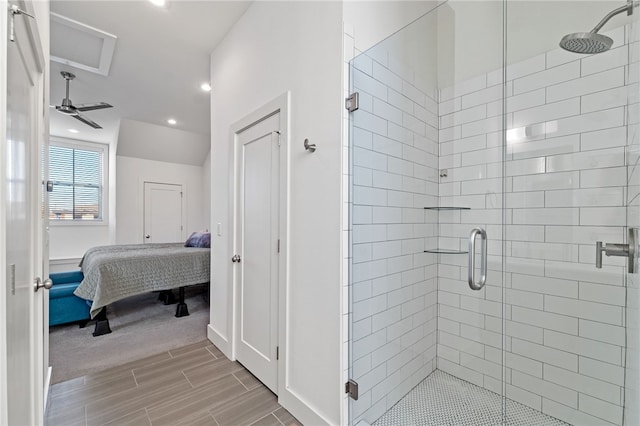 bathroom with ceiling fan and an enclosed shower