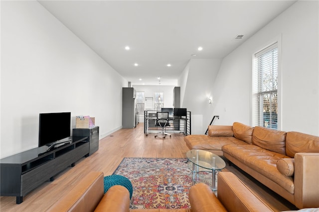 living room with light hardwood / wood-style flooring