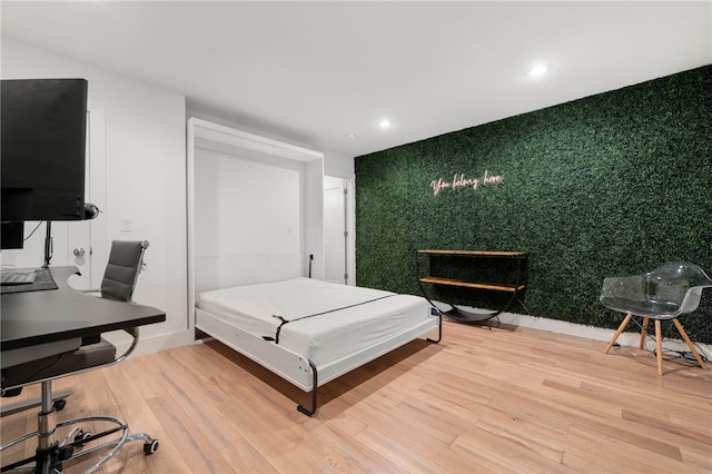 bedroom with wood-type flooring