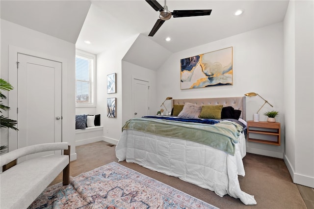 carpeted bedroom with vaulted ceiling, recessed lighting, a ceiling fan, and baseboards