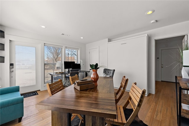 dining area featuring light wood-style flooring, visible vents, and recessed lighting