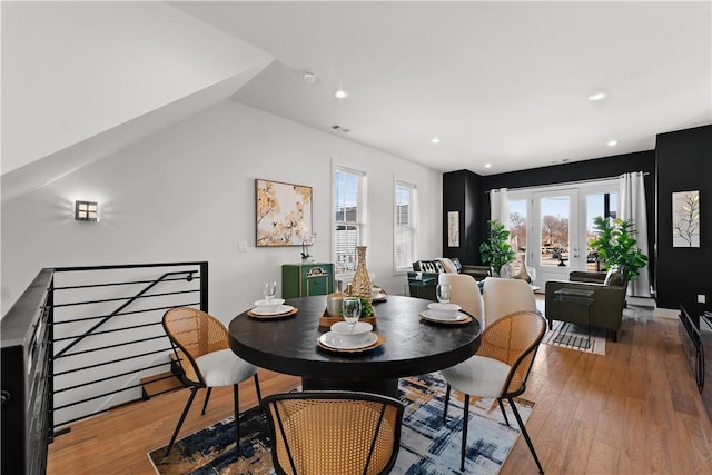 dining room with french doors, wood finished floors, visible vents, and recessed lighting