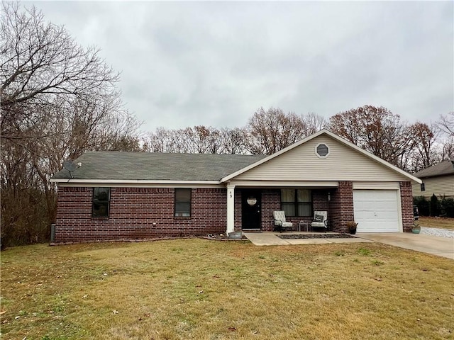 single story home featuring a garage and a front yard