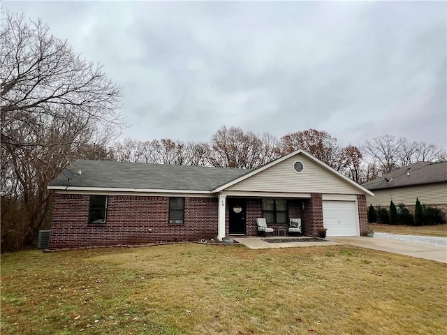 single story home with a garage and a front lawn