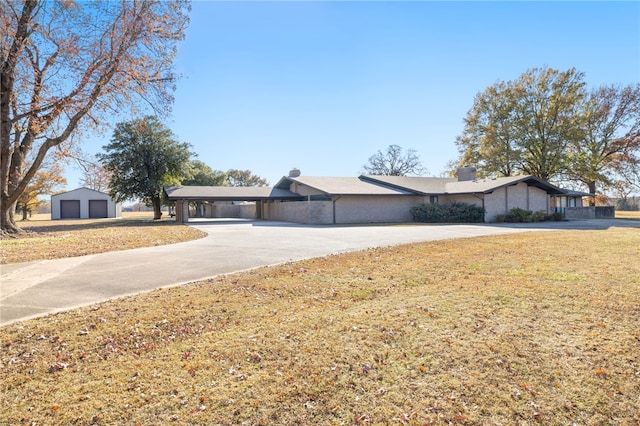 ranch-style home with a front lawn, a garage, and a carport