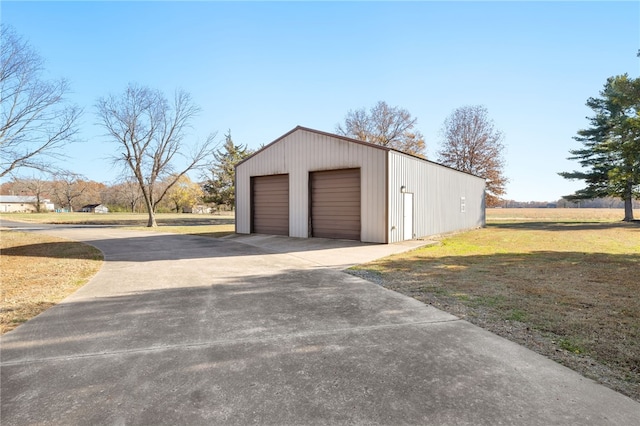 305 Irving St, Gravette, AR 72736 - garage with a lawn
