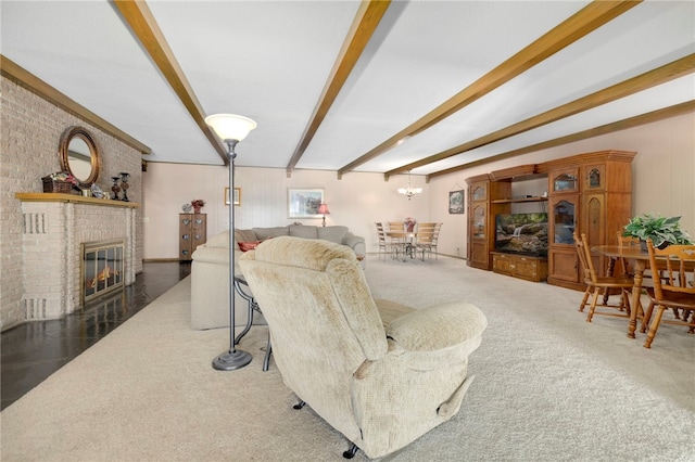 305 Irving St, Gravette, AR 72736 - living room featuring beam ceiling, a fireplace, and a chandelier