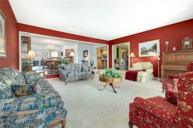 305 Irving St, Gravette, AR 72736 - carpeted living room featuring a notable chandelier