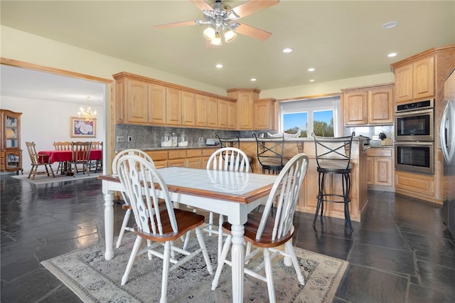 305 Irving St, Gravette, AR 72736 - kitchen featuring ceiling fan with notable chandelier, light brown cabinetry, backsplash, and double oven