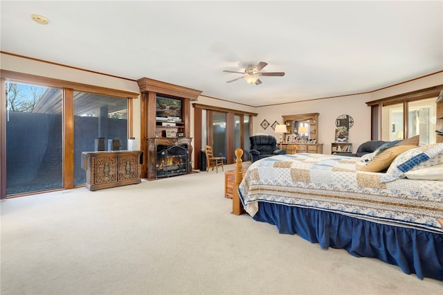 305 Irving St, Gravette, AR 72736 - carpeted bedroom with access to outside and ceiling fan