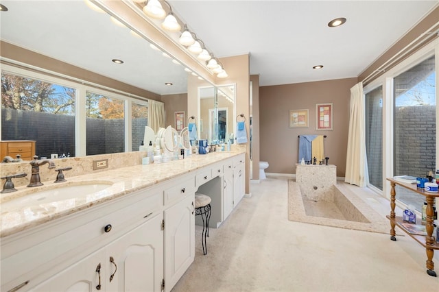 305 Irving St, Gravette, AR 72736 - bathroom featuring vanity, a healthy amount of sunlight, and toilet
