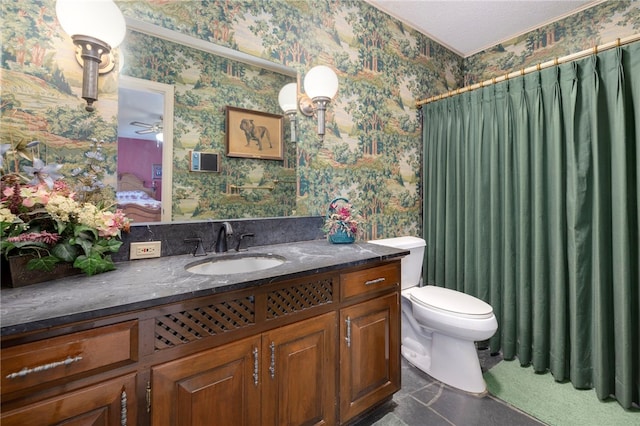 305 Irving St, Gravette, AR 72736 - bathroom featuring ceiling fan, vanity, a textured ceiling, and toilet