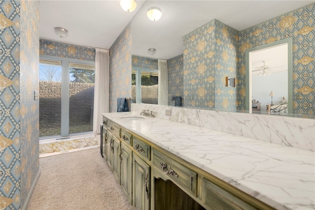 305 Irving St, Gravette, AR 72736 - bathroom featuring vanity and ceiling fan