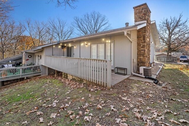 view of side of property featuring central AC unit