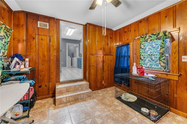 interior space with washing machine and dryer and ceiling fan