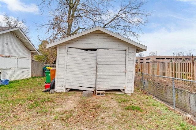 view of outdoor structure featuring a lawn