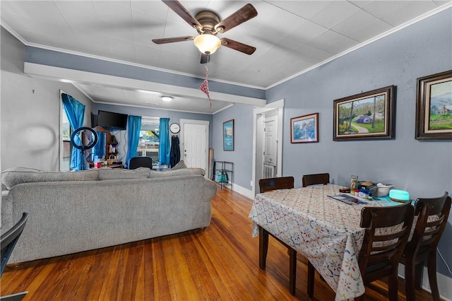 dining area featuring hardwood / wood-style flooring, ceiling fan, and crown molding