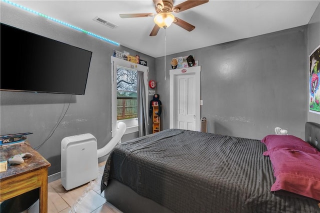 tiled bedroom with ceiling fan