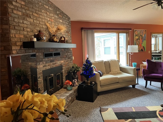 carpeted living room with ceiling fan, a fireplace, a textured ceiling, and vaulted ceiling