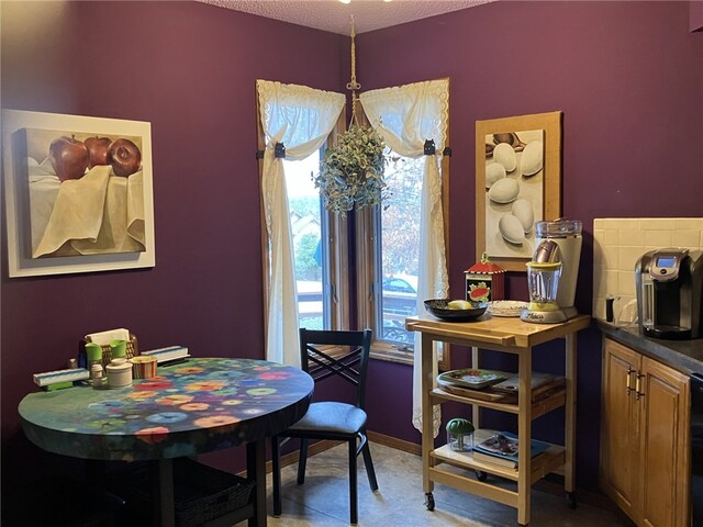 dining room featuring a textured ceiling