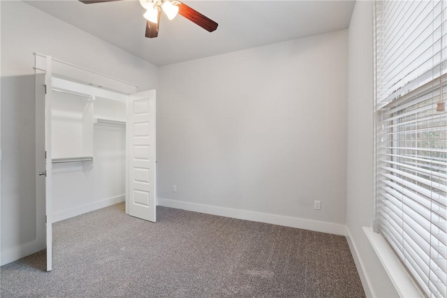 unfurnished bedroom featuring carpet, a closet, and ceiling fan