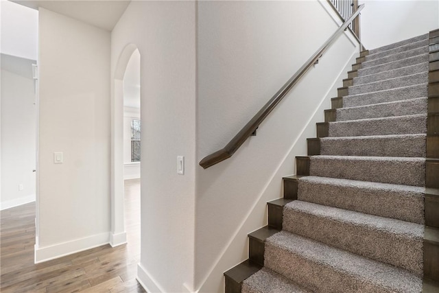 staircase featuring hardwood / wood-style floors