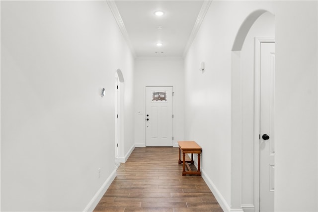 corridor with crown molding and dark hardwood / wood-style floors