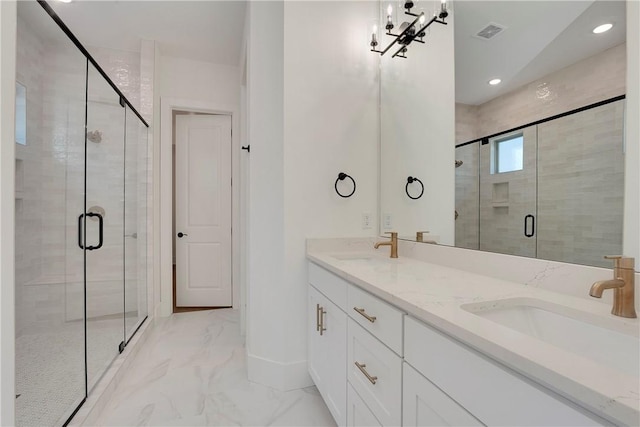 bathroom featuring visible vents, double vanity, a stall shower, a sink, and marble finish floor