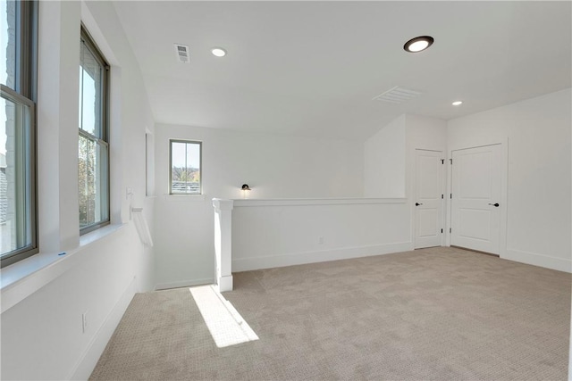 interior space featuring recessed lighting, visible vents, and baseboards