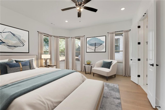 bedroom with recessed lighting, a ceiling fan, and light wood finished floors