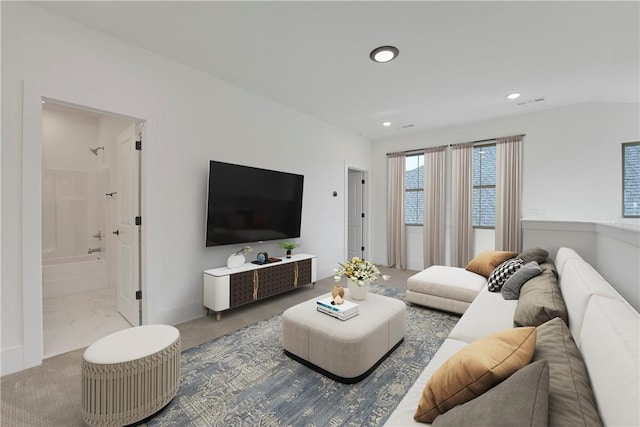 living area featuring recessed lighting, carpet, and baseboards