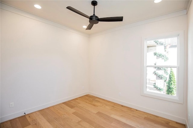 unfurnished room with ornamental molding, a healthy amount of sunlight, and wood-type flooring