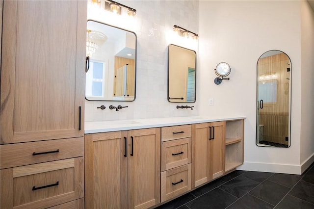 bathroom featuring tile patterned flooring, decorative backsplash, and vanity