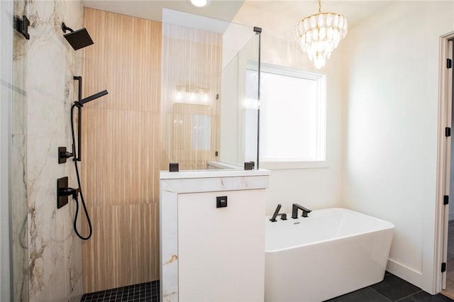 bathroom featuring tile patterned flooring, a notable chandelier, and shower with separate bathtub