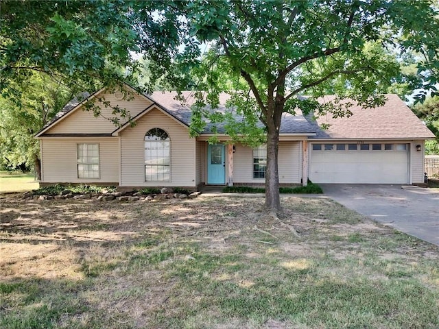 ranch-style home featuring a garage