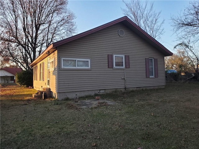 view of home's exterior featuring a lawn